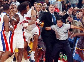 Officials and coaches try to separate Ben Wallace of the Detroit Pistons and Ron Artest (far right) of Indiana Pacers moments before an on-court shoving match escalated into a brawl between players and fans at the Palace of Auburn Hills, Michigan in 2004. (Image: YouTube)