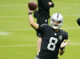 Quarterback Marcus Mariota, seen here playing for the Las Vegas Raiders in 2020, is linked in trade rumors with multiple teams. (Image: John Locher/AP)