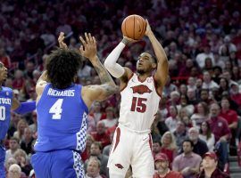 Arkansas guard Mason Jones fades away for a jumper against Kentucky. (Image: Michael Woods/AP)