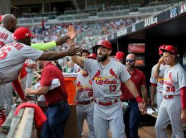 Matt Carpenter gets congratulations from his St. Louis Cardinals teammates after he scored during a 10-run first inning against the Atlanta Braves in Game 5 of the 2019 NLDS in Atlanta. (Image: David Carson/St. Louis Dispatch)