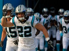 RB Christian McCaffrey leads the Carolina Panthers onto the field in a game in Charlotte, NC. (Image: Grant Halverson/Getty)