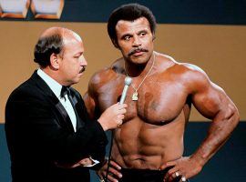 "Mean" Gene Okerlund interviews Rocky Johnson during a WWE broadcast in the early 1980s. (Image: WWE)