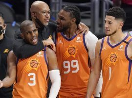 Monty Williams, head coach of the Phoenix Suns, celebrates a victory with Chris Paul (3) and Jae Crowder (99). (Image: Getty)