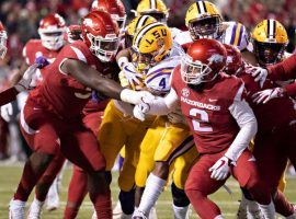 LSU’s running back Nick Brossette stopped short of the end zone and let Arkansas prevent him from scoring. (Image: Getty)