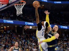 Gary Payton II from the Golden State Warriors absorbs a flagrant foul from Dillon Brooks of the Memphis Grizzlies in the first quarter of Game 2. (Image: Brandon Dill/AP)