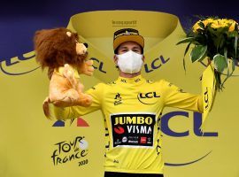 Primoz Roglic at the Stage 9 podium and wearing the leader's yellow jersey for the first time. (Image: AP)