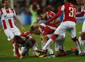 Red Star Belgrade players celebrate after the first goal of their 2-0 victory over Liverpool in Champions League play. (Image: AP/Darko Vojinovic)