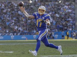 Quarterback Philip Rivers, from the LA Chargers, rolling out in a game against the Arizona Cardinals in Carson, CA. (Image: Robert Gauthier/LA Times)