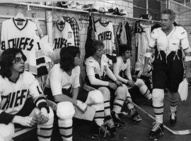 The Hansen brothers listen to their player/coach Reggie Dunlop (Paul Newman) in "Slap Shot" (1977). (Image: AP)