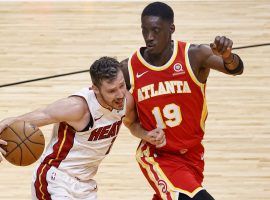 Tony Snell (19) of the Atlanta Hawks defends Goran Dragic of the Miami Heat during Southeast Division action. (Image: Rhona Wise/USA Today Sports)