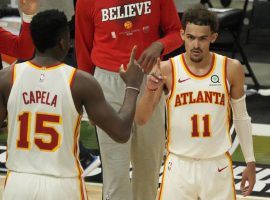 Clint Capela (15) of the Atlanta Hawks congratulates teammate Trae Young after dropping 48 points against the Milwaukee Bucks in a Game 1 victory at the Fiserv Forum in Milwaukee. (Image: Getty)