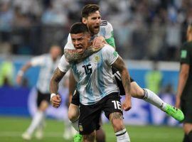 Argentina teammates celebrate a goal against Nigeria that got them to the Round of 16. (Image: Getty)