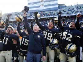 Army coach Jeff Monken is surrounded by his players in a recent victory. (Image: AP)