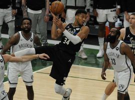 Giannis 'Greek Freak' Antetokounmpo grabs a rebound for the Milwaukee Bucks against the Brooklyn Nets in Game 6 of the 2021 Eastern Conference Finals. (Image: Michael McLoone/USA Today Sports)