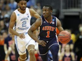 Auburn point guard Jared Harper (1)chased down by North Carolina guard Coby White in the March Madness Sweet 16 in Kansas City, MO.  (Image: Christian Petersen/Getty)