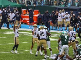 Navy kicker Bijan Nichols celebrates as he converted a 33-yard field goal as time ran out to upset Tulane, 27-24. (Image: USA Today Sports)