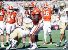 Defensive lineman Nyles Pinckney celebrates after scoring a touchdown in in of College Football Week 7 highlights. (Image: USA Today Sports)