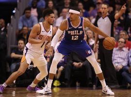 Philadelphia 76ers swingman Tobias Harris takes Phoenix Suns guard Devin Booker one-on-one in Phoenix. (Image: Christian Peterson/Getty)