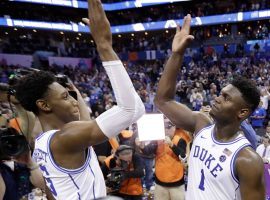 Freshman guard RJ Barrett from Duke celebrates with teammate Zion Williamson (right) after beating FSU in the ACC championship in Charlotte, North Carolina. (Image: Chuck Burton/AP)