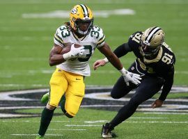 Green Bay Packers running back Aaron Jones evades a tackler on SNF. (Image: Sean Gardner/Getty)