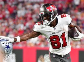 Tampa Bay Bucs WR Antonio Brown stiff arms a defender from the Dallas Cowboys in Week 1. (Image: Julio Aguilar/Getty)