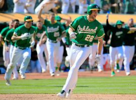 The A's celebrate a walk-off hit by Matt Olson in Oakland Stadium. (Image: Dan Shirley/Getty)