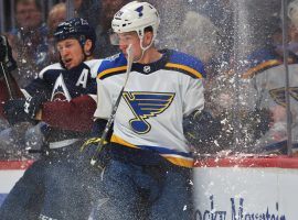 Colorado Avalanche Nathan MacKinnon checks St Louis Blues Vince Dunn at the Pepsi Center in Denver, CO. (Image: Hyoung Chang/Denver Post)