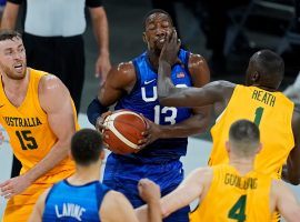 Bam Adebayo from Team USA takes a smack in the face from Duop Reath on Australia in an exhibition game and Olympics warm up at Mandalay Bay in Las Vegas. (Image: John Locher/AP)