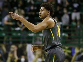 Baylor Bears senior guard MaCio Teague points to a teammate that dished him an assist. (Image: Raymond Carlin III/USA Today Sports)