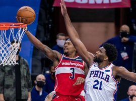 Bradley Beal of the Washington Wizards, seen here, drives to the basket against Joel Embiid of the Philadelphia 76ers. Beal scored a career-high 60 points. (Image: Getty)