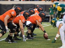 The Big 12 Championship features a rematch between playoff hopeful Oklahoma State and a Baylor team seeking its first conference title. (Image: Brett Rojo/USA Today Sports)