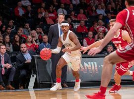 Richmond guard, Blake Francis, drives against Wisconsin in the Legends Classic tournament in Brooklyn, NY. (Image: AP)