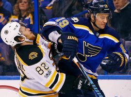 St. Louis Blues D Jay Bouwmeester bangs with Boston Bruins RW David Pastrnak at the Enterprise Center in St. Louis. (Image: Billy Hurst/AP)