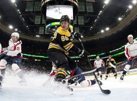 Boston Bruins winger David Pastrnak attempts a deflection against the Washington Capitals. (Image: Winslow Townson/USA Today Sports)