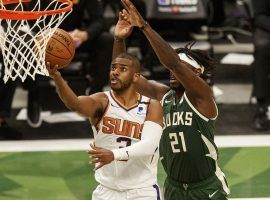 Chris Paul from the Phoenix Suns is defended by Jrue Holiday from the Milwaukee Bucks in Game 4 of the NBA Finals. (Image: Christian Petersen/Getty)