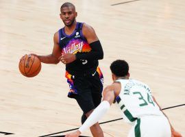 Giannis â€˜Greek Freakâ€™ Antetokounmpo from the Milwaukee Bucks defends Chris Paul of the Phoenix Suns in Game 1 of the 2021 NBA Finals at Phoenix Suns Arena. (Image: Getty)