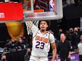 Cam Johnson from the Phoenix unleashes a rim-rocking dunk over PJ Tucker in Game 3 of the NBA Finals. (Image: AZSports/Twitter)