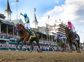 The image of a Kentucky Derby winner -- like Victor Espinoza aboard American Pharoah in 2015 - was absent from May due to the coronavirus. That impacted horse racing betting handles for the month. (Image: Mark Cornelison/Lexington Herald via Getty)