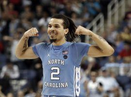 North Carolina guard Cole Anthony flexes after hitting a 3-pointer early in the 2019-20 season. (Image: Gerry Broome/AP)