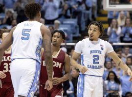 North Carolina guard Cole Anthony (right) celebrates a big shot with Armando Bacot (5) during a victory over Elon in Chapel Hill, NC. (Image: Ben McKeown/AP)