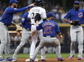 The Chicago Cubs try to tag Christian Yelich of the Milwaukee Brewers during an NL Central division game. (Image: Porter Lambert/Getty)