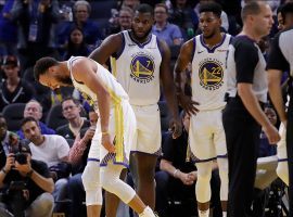 Golden State Warriors All-Star Steph Curry reacts to a broken left hand during a game against the Phoenix Suns in San Francisco, CA. (Image: Ben Margot/AP)