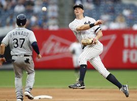 NY Yankees second baseman DJ LeMahieu turns a double play against the Tampa Rays at Yankees Stadium in the Bronx. The Yankees signed LeMahieu to a long-term deal through the end of the 2026 season. (Image: Kathy Willens/AP)