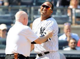 Yankees trainer checks on Edwin Encarnacion after he breaks his hand against the Boston Red Sox. (Image: Getty)