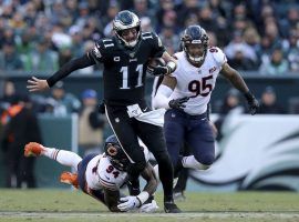 Philadelphia Eagles QB Carson Wentz evades the Chicago Bears defense. (Image: Brad Penner/AP)