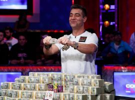 Germanyâ€™s Hossein Ensan poses with his bracelet and his $10 million in prize money after winning the 2019 World Series of Poker main event.