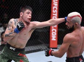 Brandon Moreno (left) will get a second shot at flyweight champion Deiveson Figueiredo at UFC 263 on Saturday. (Image: Jeff Bottari/Zuffa/Getty)