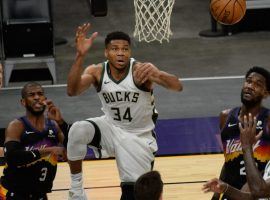 Giannis 'Greek Freak' Antetokounmpo (34) takes a shot for the Milwaukee Bucks against the Phoenix Suns during the regular season. (Image: Getty)