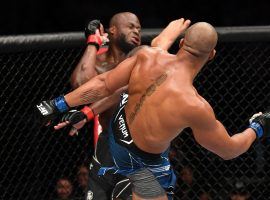 Ciryl Gane (front) dominated Derrick Lewis (rear) to win the interim UFC heavyweight championship on Saturday night. (Image: Josh Hedges/Zuffa)