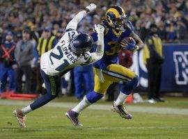 LA Rams RB Todd Gurley stiff arms Seattle Seahawks CB Tre Flowers during a victory in Week 13. (Image: Kyusung Gong/AP)